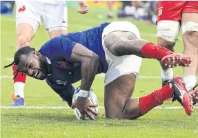  ??  ?? Fiji native Alivereti Raka scores a try for France.