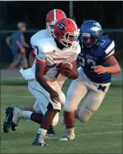  ?? LARRY GREESON / For the Calhoun Times ?? Sonoravill­e’s Patrick Moore (17) bursts past Model’s Tyler Moore during Friday’s game.