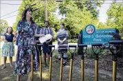  ?? ALYSSA POINTER/ALYSSA.POINTER@AJC.COM ?? Isabel Gonzalez Whitaker speaks in May during a groundbrea­king ceremony at Sara J. Gonzalez Memorial Park, the first park in Georgia named after a Latino.