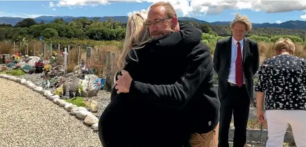  ??  ?? Andrew Little is greeted by families of the victims at a memorial on the eighth anniversar­y of the tragedy yesterday.