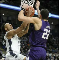  ?? GARY M. BARANEC — THE ASSOCIATED PRESS ?? Penn State’s Lamar Stevens,left, goes to the basket as Northweste­rn’s Pete Nance (22) defends.