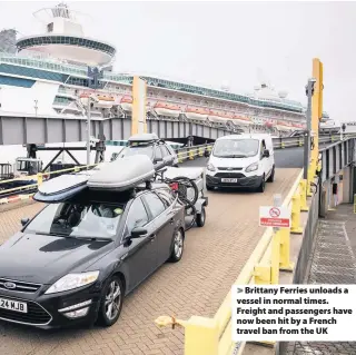  ??  ?? Brittany Ferries unloads a vessel in normal times. Freight and passengers have now been hit by a French travel ban from the UK