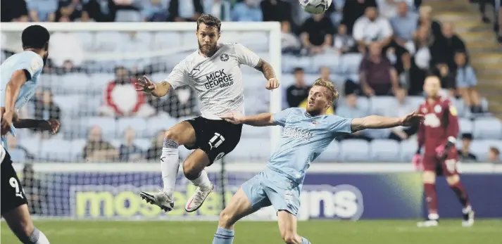  ?? ?? Jorge Grant (white) in action for Posh. Photo: Joe Dent/theposh.com