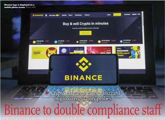  ?? Photo: AFP ?? Binance logo is displayed on a mobile phone screen.