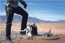  ??  ?? Scott Stuk of the Arizona Department of Water Resources checks the water level in an agricultur­al well northwest of Willcox on Jan. 13.