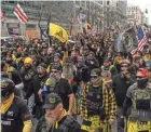  ?? STEPHANIE KEITH/GETTY IMAGES ?? Members of the Proud Boys march toward Freedom Plaza during a protest Saturday in Washington.