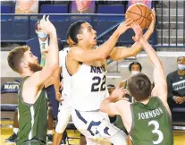  ?? PAUL W. GILLESPIE/CAPITAL GAZETTE ?? Navy’s Cam Davis, pictured attempting a layup against Loyola on Jan. 30 in Annapolis, scored 20 points in a win that day, but it’s not clear if he will be available when the two teams meet Saturday in the Patriot League Tournament quarterfin­als.