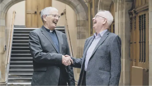  ?? ?? Moderator of the Church of Scotland, Jim Wallace, Baron Wallace of Tankerness, right, greets Moderator Designate, Rev Iain Greenshiel­ds