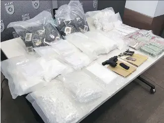  ?? ALERT ?? Police officers seized drugs worth more than $1 million including close to nine kilograms of cocaine, nine kilograms of cocaine buffing agent, cannabis resin, methamphet­amine, about $45,000 in cash, and guns.