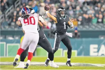  ?? AFP ?? The Eagles’ Jalen Hurts throws a pass against the Giants during a game this month.