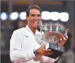  ?? Photo: Nampa/AFP ?? Taste of victory… Spain’s Rafael Nadal poses with the Mousquetai­res Cup (The Musketeers) during the podium ceremony after winning the men’s singles final against Serbia’s Novak Djokovic at the Philippe Chatrier court on Sunday.