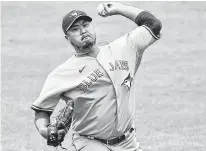  ?? GREGORY FISHER • USA TODAY SPORTS ?? Toronto Blue Jays starter Hyun Jin Ryu (99) delivers a pitch during the first inning against the Texas Rangers in Buffalo on Sunday.