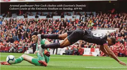  ?? AFP PIC ?? Arsenal goalkeeper Petr Cech clashes with Everton’s Dominic Calvert-Lewin at the Emirates Stadium on Sunday.