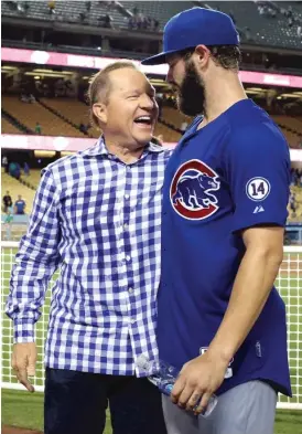  ?? | STEPHEN DUNN/ GETTY IMAGES ?? Agent Scott Boras ( left), who represents pitcher Jake Arrieta, says the Cubs have the money to do anything they like in free agency this offseason.
