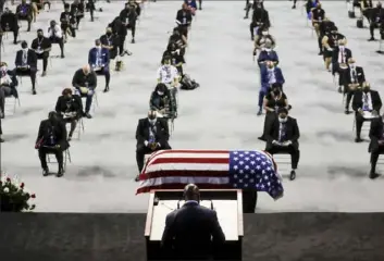  ?? Brynn Anderson/Associated Press ?? The Rev. Darryl Caldwell speaks as the casket of the late Rep. John Lewis, D-Ga., lies in repose during a service Saturday celebratin­g “The Boy from Troy” at Troy University in Troy, Ala.