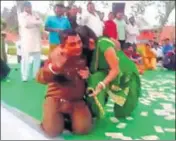  ??  ?? A video grab showing head warden Satwan Singh with a woman dancer at Jind Jail during a Holi programme on March 7.