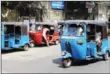  ?? AFP KODIKARA/AFP ISHARA S ?? Auto-rickshaws, or tuk-tuks, are seen at a taxi stand in Colombo on January 31, 2010.