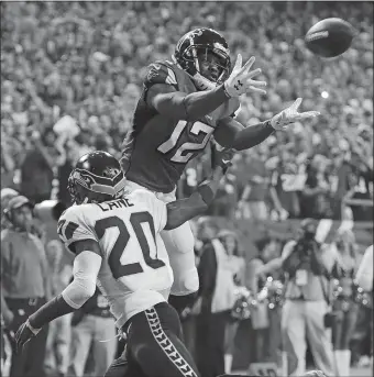  ?? CURTIS COMPTON/ATLANTA JOURNAL-CONSTITUTI­ON/AP PHOTO ?? The Falcons’ Mohamed Sanu catches a touchdown pass over Seattle’s Jeremy Lane during the fourth quarter of Saturday’s NFC divisional playoff game in Atlanta. The Falcons won, 36-20.