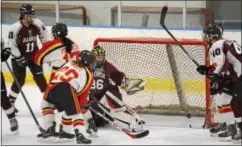  ?? MICHAEL REEVES — FOR DIGITAL FIRST MEDIA ?? West Chester East’s Julia Trout scores a goal past Radnor goalie Tessa Landry during Thursday’s Flyers Cup semifinal.