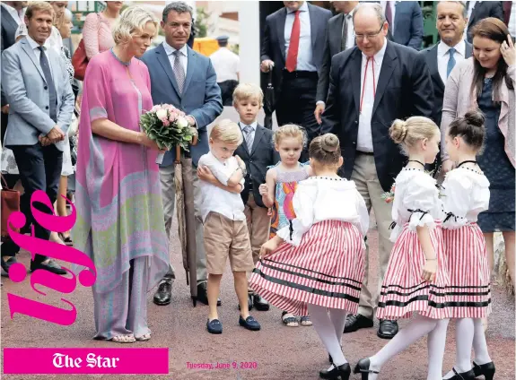  ??  ?? Prince Albert
II of Monaco and his wife Princess Charlene arrive with their twins Prince Jacques and Princess Gabriella. Charlene is using her platform to do her bit in alleviatin­g hunger and unemployme­nt
|
Reuters