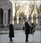  ?? (AP/Evan Vucci) ?? In Washington on Tuesday, President Joe Biden and first lady Jill Biden visit the National World War II Memorial to mark the 80th anniversar­y of the Japanese attack on Pearl Harbor.