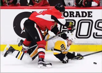  ?? The Canadian Press ?? Ottawa Senators defenceman Marc Methot takes down Pittsburgh Penguins centre Sidney Crosby during the third period of Game 6 of the NHL Eastern Conference final in Ottawa on Tuesday. Ottawa won 2-1.