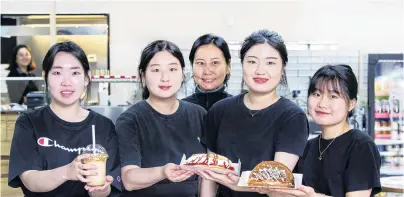 ?? PHOTO: JACOB MCSWEENY ?? Tasty menu . . . Crazy Waffle staff members (from left) Louise Kim, Hamin Yun, Ellie Jung, Lily Kim and Na Hyun Kim show off some of the waffles at the new Dunedin shop.
