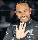  ?? ?? Smiles better: Lewis Hamilton was pleased with the upgrades made to the Mercedes car