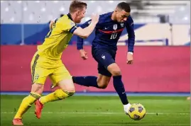  ?? (Photo AFP) ?? Mbappé fait partie de la « famille » appréciée par Deschamps.