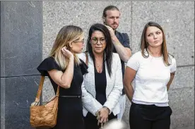 ?? DREW ANGERER / GETTY IMAGES ?? Annie Farmer (left) and Courtney Wild (right), alleged victims of Jeffrey Epstein, stand with their lawyers Monday at federal court in New York following a bail hearing for Jeffrey Epstein. The judge will make a ruling regarding bail Thursday.
