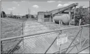  ?? AP ?? A gate at the U.S. Oil Recovery Superfund site is seen Thursday in Pasadena, Texas, where three tanks once used to store toxic waste were flooded during Hurricane Harvey.