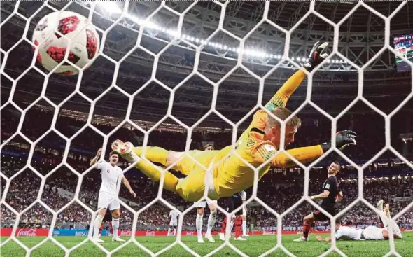  ?? REUTERS PIC ?? Croatia’s Ivan Perisic (in black) scores their first goal during their World Cup semi-final match against England.