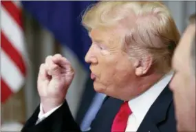  ?? PABLO MARTINEZ MONSIVAIS — THE ASSOCIATED PRESS ?? U.S. President Donald Trump gestures while speaking to NATO Secretary General Jens Stoltenber­g during their bilateral breakfast, Wednesday in Brussels, Belgium.