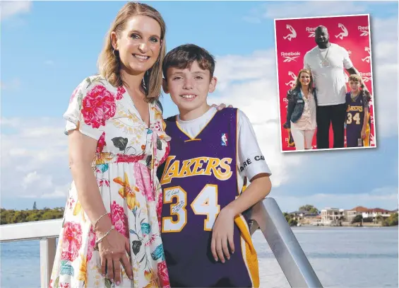  ?? ?? Reggie Bird and son Lucas Sorensen, 13, proudly wearing the NBA singlet signed by NBA superstar Shaquille O'Neal. Main picture: Regi Varghese