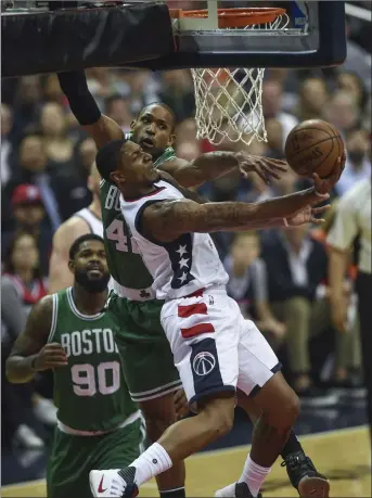  ?? Photo by Tom L. Sandys / The Washington Post ?? Al Horford (42) and the Boston Celtics have won all three of their home games in the Eastern Conference semifinals against Bradley Beal (right) and the Wizards. The teams meet Monday at the TD Garden in Game 7.