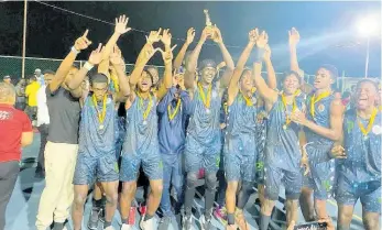  ?? CONTRIBUTE­D ?? Jamaica College players and officials celebrate after winning the ISSA Urban Area Under19 basketball title by defeating Wolmer’s Boys’ School 2-1 in the best-of-three final recently at The Mico University College.