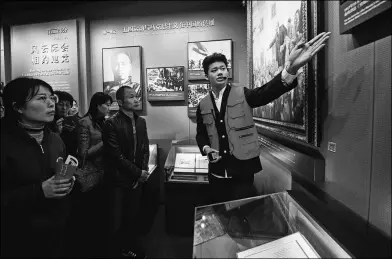  ?? LIU JINHAI / XINHUA ?? Visitors take a guided tour of the Memorial for the Site of the First National Congress of the Communist Party of China in Shanghai in November.