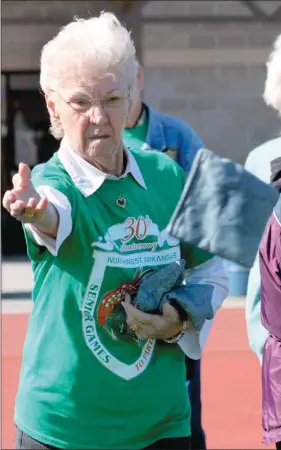  ??  ?? Agnes Lombard of Lincoln Senior Center throws a bean bag in Baggo at the Senior Games in Harrison. Five senior adults from the Lincoln center participat­ed in the annual event sponsored by Area Agency on Aging of Northwest Arkansas. Athletes received...