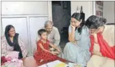  ?? HT PHOTO ?? The Uttar Pradesh State Commission for Protection of Child Rights team with Ananya Verma. The team said she is a wonder girl but said she will be under mental pressure if she is sent to Class 9.