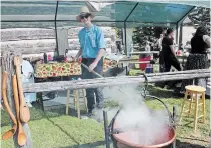  ?? KRIS DUBE TORSTAR FILE PHOTO ?? Kurtis Davidson stirs a kettle of apple butter at the 2019 Marshville Heritage Festival, which was cancelled in May.