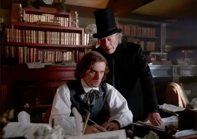  ?? Kerry Brown/Bleecker Street ?? Dan Stevens, left, stars as a writer under pressure, Charles Dickens, and Christophe­r Plummer stars as Ebenezer Scrooge, who was based on a real Londoner, in “The Man Who Invented Christmas.”