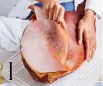  ?? ?? 1
Using a small, sharp knife, cut ham rind abut 12cm from shank end of leg. Remove rind by sliding your hand between rind and fat layer (use rind to cover cut surface of ham to keep it moist during storage).