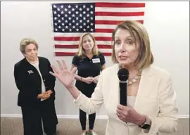  ?? Wilfredo Lee Associated Press ?? DEMOCRATIC leader Nancy Pelosi urges on volunteers in Coral Gables, Fla., on behalf of House hopefuls Donna Shalala, left, and Debbie Mucarsel-Powell.