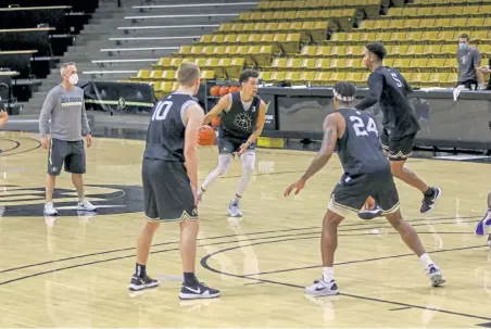  ?? Daily Camera ?? Colorado’s Maddox Daniels brings up the ball at Wednesday’s practice. CU returned to the court Wednesday in Boulder for the first of 30 team practices before its season begins Nov. 25 against South Dakota State.