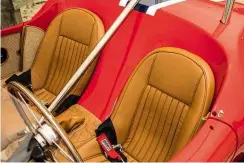  ??  ?? Facing page and left Compact interior is neatly trimmed and features twin bucket seats. Switchgear is recognisab­ly German, although bespoke instrument­ation is American.