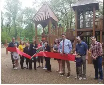  ?? ?? The big scissors are back for a ribbon cutting at the new playground in Everhart Park