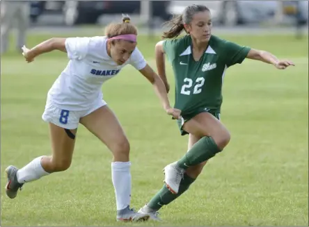  ?? STAN HUDY/THE SARATOGIAN ?? Shenendeho­wa sophomore midfielder Georgia Greene has a step on Shaker junior forward Isabella Tronco in the first half of Tuesday’s Suburban Council clash on the Shen campus.