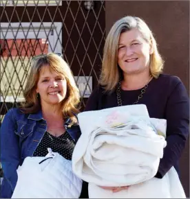  ?? MELANIE EKSAL/Penticton Herald ?? Pamela Hanson, left, and Lyndi Cruickshan­k are encouragin­g everyone to contribute to the annual Cover With Kindness blanket drive.