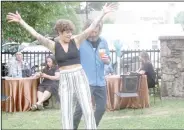  ?? (NWA Democrat-Gazette/Marc Hayot) ?? Amanda Orcutt (left) and Peter Orcutt dance the night away at the Main Event on Friday Night at the Park House Kitchen + Bar.