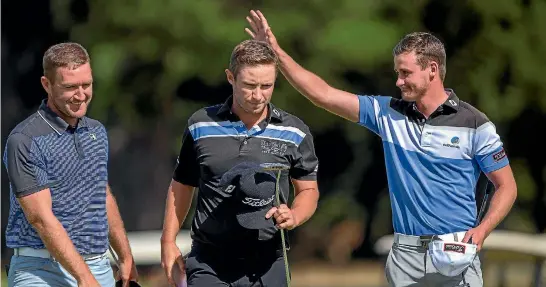  ?? PHOTO: MURRAY WILSON/FAIRFAX NZ ?? Australian Jarryd Felton, right, celebrates his New Zealand PGA Championsh­ip win after beating Josh Younger, left, and Ben Campbell, centre, in a playoff.